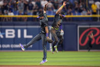 Tampa Bay Rays second baseman Amed Rosario, left, celebrates with shortstop Jose Caballero after the Rays defeated the New York Mets during a baseball game Friday, May 3, 2024, in St. Petersburg, Fla. (AP Photo/Chris O'Meara)