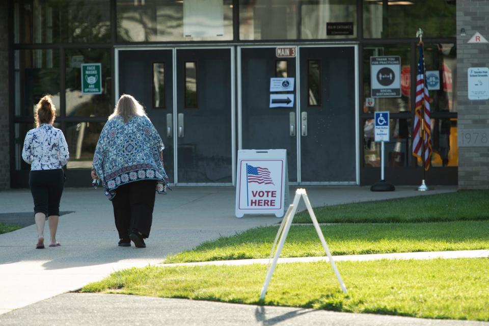 Two women enter the voting site at Memorial Elementary School in Little Ferry, N.J. on Tuesday June 7, 2022. 