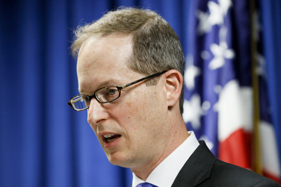 U.S. Attorney Benjamin C. Glassman speaks during a news conference, Wednesday, Oct. 10, 2018, in Cincinnati. The Justice Department says a Chinese intelligence operative has been charged with stealing trade secrets from multiple U.S. aviation and aerospace companies. Yanjun Xu was charged Wednesday with conspiring and attempting to commit economic espionage and theft of trade secrets. (AP Photo/John Minchillo)