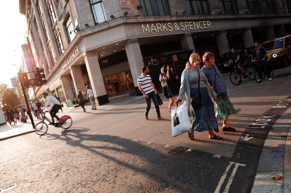 Shoppers cross a junction in front of a branch of clothing and food retailer Marks and Spencer on Oxford Street in London, England, on September 16, 2020. While the UK continues to edge towards economic recovery some 3,991 new coronavirus cases were recorded today, in what is the highest daily figure in the country since May 8. Prime Minister Boris Johnson meanwhile today told a parliamentary committee that he did not want a second national lockdown as part of the ongoing response to the covid-19 crisis. (Photo by David Cliff/NurPhoto via Getty Images)