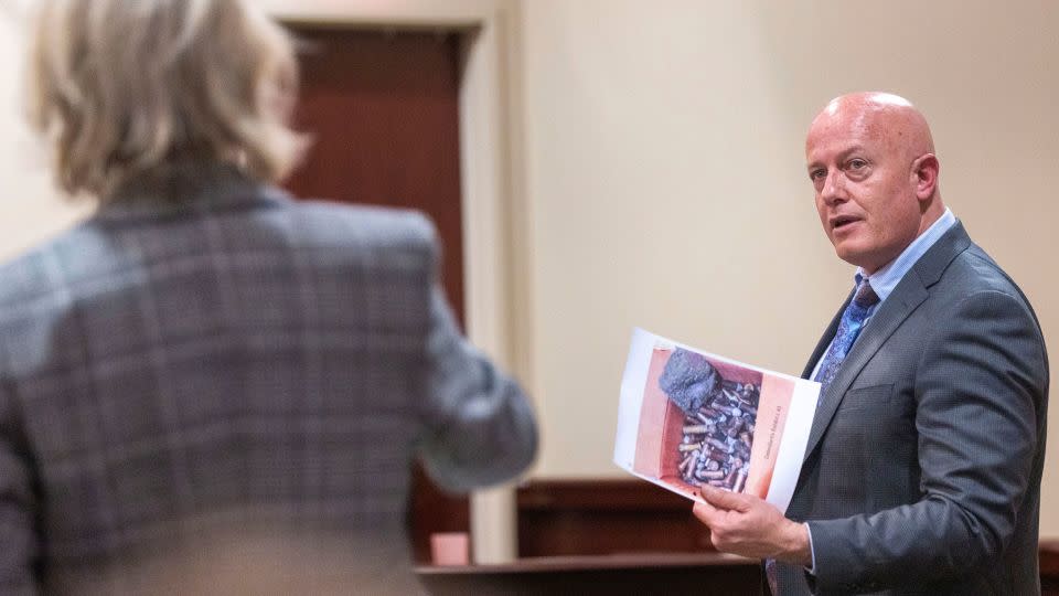 Special prosecutor Kari Morrissey, left, and defense attorney Jason Bowles discuss showing a picture to a witness during the trial. - Luis Sánchez Saturno/Pool/Santa Fe New Mexican/AP