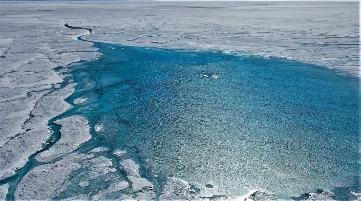 Meltwater lakes feed rivers that snake across the ice sheet - until they encounter a moulin. Alun Hubbard