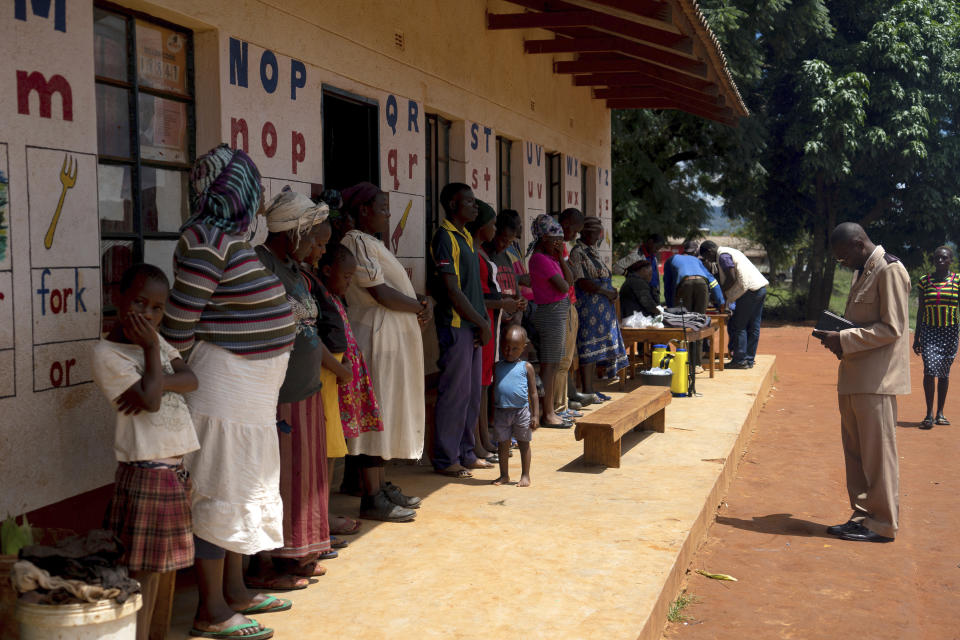 The Salvation Army holds a prayer service for members displaced in Chimanimani, Zimbabwe Sunday, March 24 2019. Cyclone Idai's death toll has risen above 750 in the three southern African countries hit 10 days ago by the storm, as workers restore electricity, water and try to prevent outbreak of cholera, authorities said Sunday. (AP Photo/KB Mpofu)