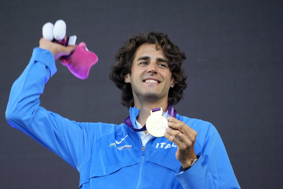 Gold medalist Gianmarco Tamberi, of Italy, poses on the podium of the men's high jump at the European Athletics Championships in Rome, Wednesday, June 12, 2024. (AP Photo/Stefano Costantino)