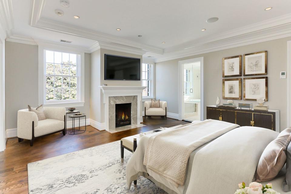 The spacious master bedroom includes a fireplace and views of Georgetown.