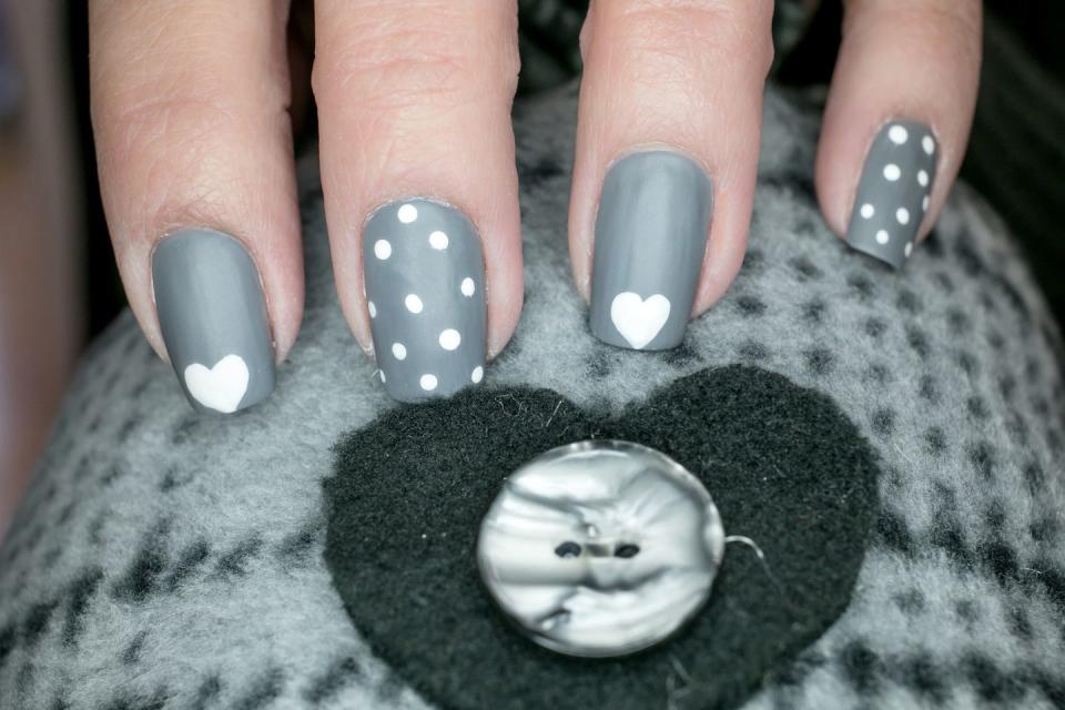 <p>Not into pink? Go with gray nail polish, but make it fun with some hearts and polka dots.</p>