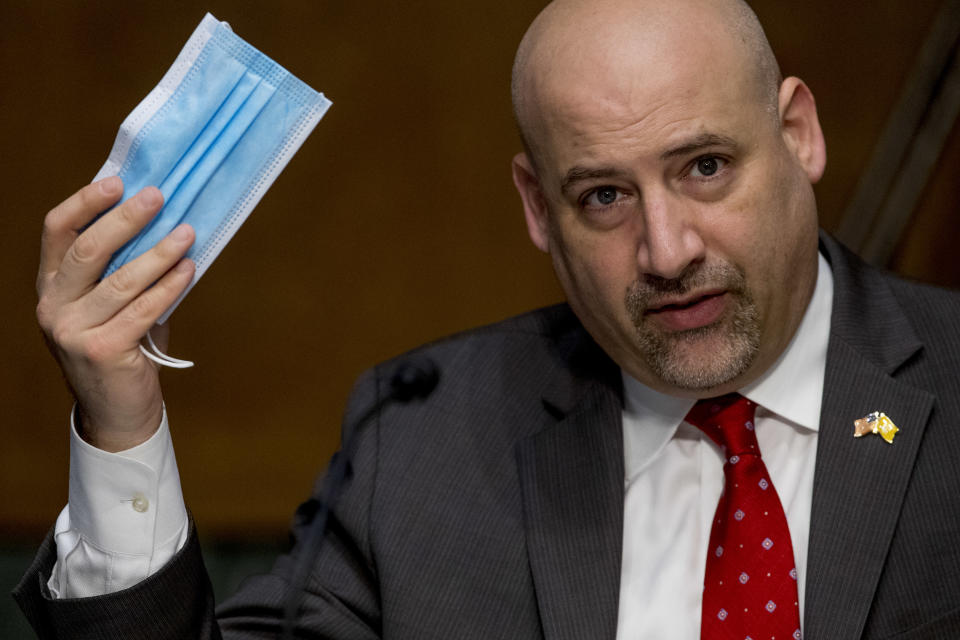 WASHINGTON, DC - JUNE 09: Justice Department U.S. Attorney Craig Carpenito holds up a face mask as he speaks during a Senate Judiciary Committee hearing to examine COVID-19 fraud, focusing on law enforcement's response to those exploiting the pandemic, on Capitol Hill on June 9, 2020 in Washington, DC.  (Photo by Andrew Harnik - Pool/Getty Images)