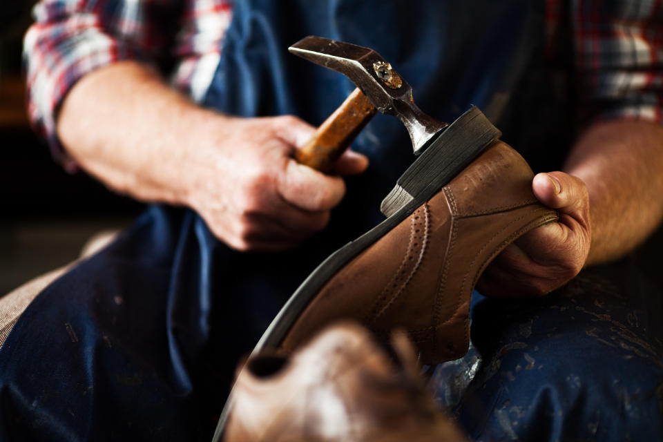 cobbler taking a hammer to a shoe