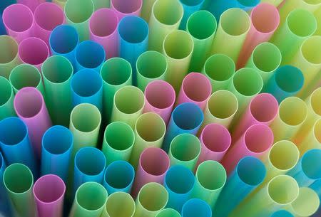 FILE PHOTO: Drinking straws protrude from a glass in a illustration picture in Loughborough, Britain April 19, 2018. REUTERS/Darren Staples/File Photo