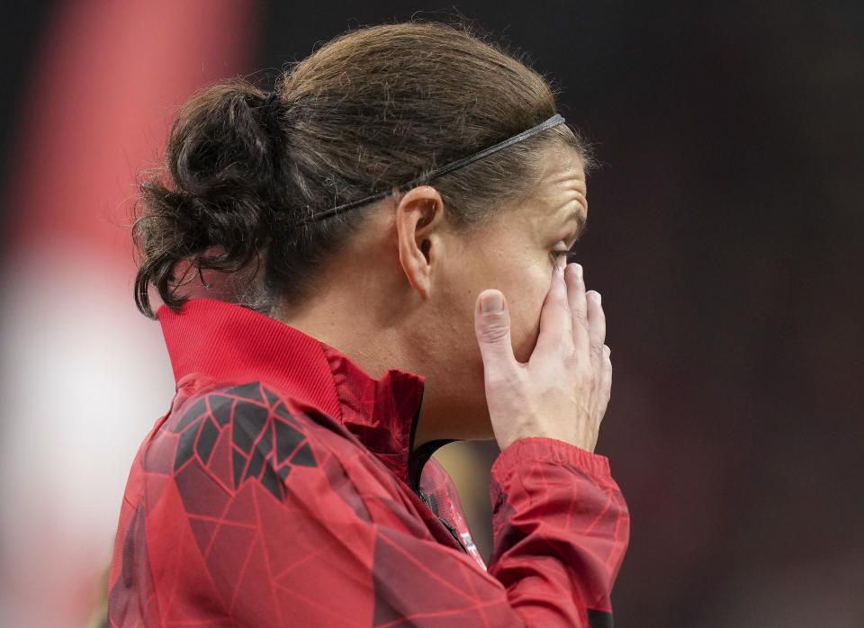 Canada's Christine Sinclair wipes away tears while being honored before the team's international friendly soccer match against Australia on Tuesday, Dec. 5, 2023, in Vancouver, British Columbia. Sinclair, 40, was making her 331st and final appearance for Canada. (Darryl Dyck/The Canadian Press via AP)