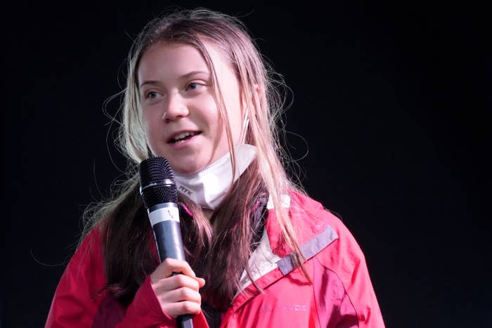 Greta holding a microphone