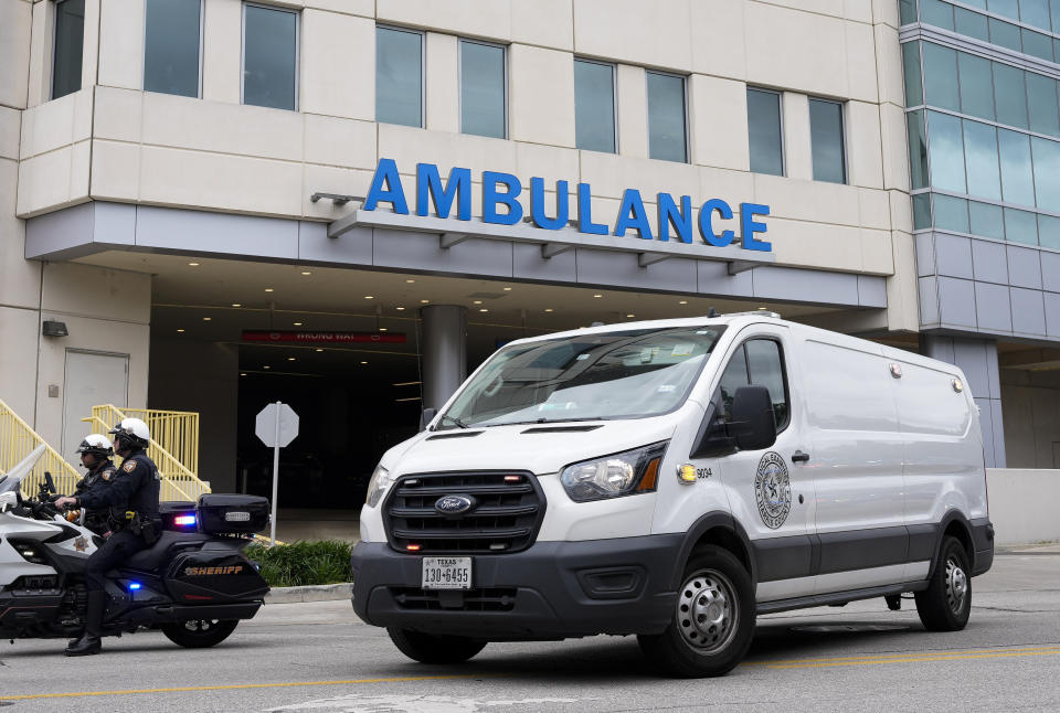 A procession for fallen Harris County Sheriff's Deputy John Hampton Coddou taking off from Memorial Hermann Medical Center to Harris County Institute of Forensic Sciences, Tuesday, April 23, 2024, in Houston. The deputy was struck by a vehicle while responding to a crash on Highway 99 and Cumberland Ridge Drive in Cypress, Texas. He was transported by Life Flight in critical condition to Memorial Hermann where he later died. (Yi-Chin Lee/Houston Chronicle via AP)