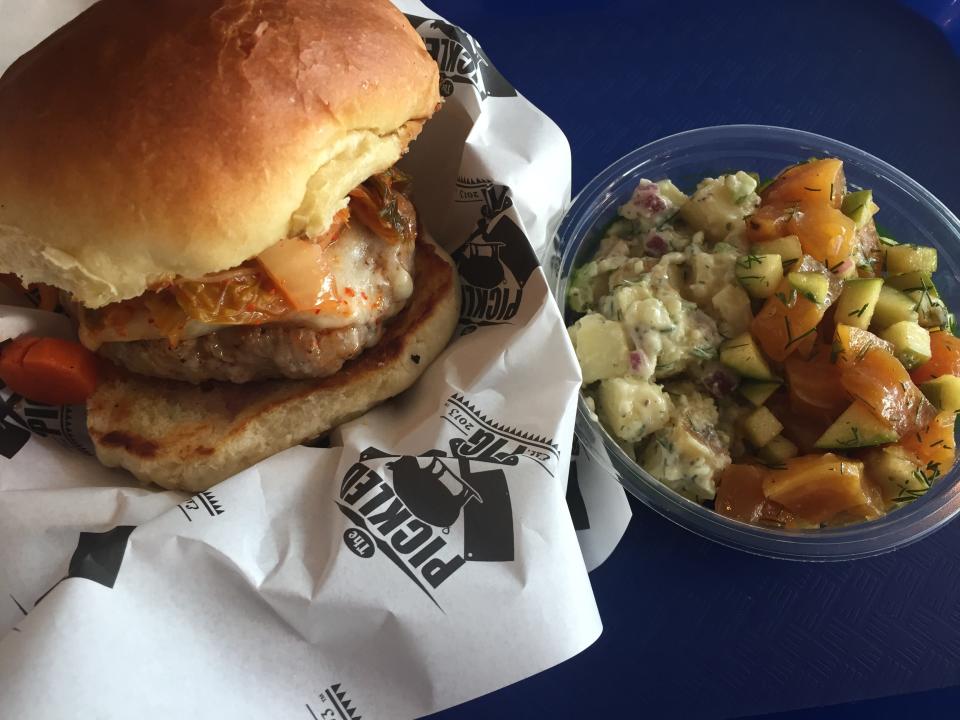 The pork burger at the Pickled Pig in Walnut Hills is made with ground pork, kimchee and gouda.