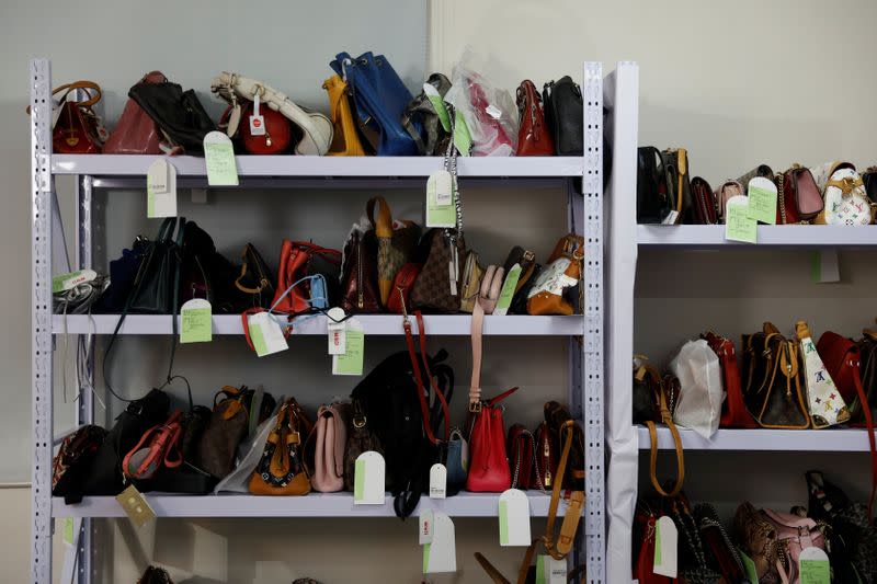 Handbags are seen on shelves during a livestreaming session for the second-hand luxury goods retail platform Plum in Beijing