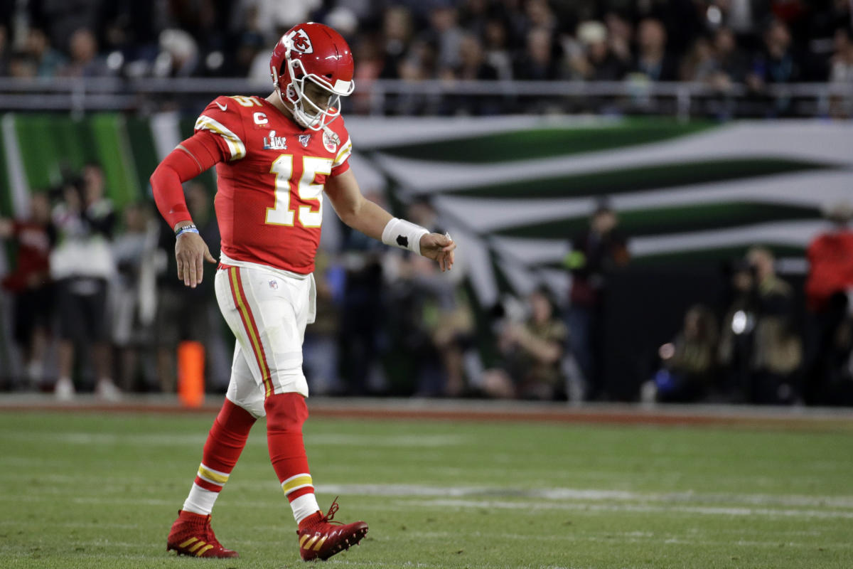 The Chiefs and 49ers stand at the 24-yard line to pay tribute to