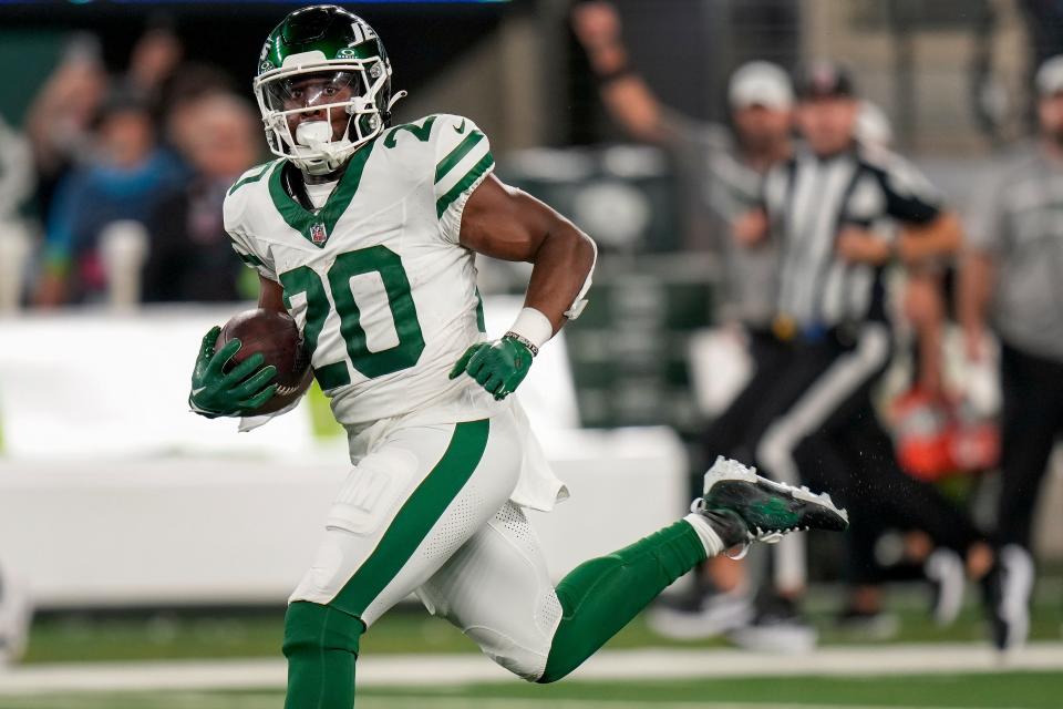 New York Jets running back Breece Hall (20) carries the ball against the Buffalo Bills during the second quarter of an NFL football game, Monday, Sept. 11, 2023, in East Rutherford, N.J. (AP Photo/Seth Wenig)