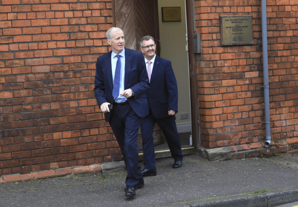 Democratic Unionist Party members Jeffrey Donaldson MP, right, and Gregory Campbell leave the party headquarters in east Belfast after voting took place to elect a new leader on Friday May 14, 2021. Edwin Poots and Jeffrey Donaldson are running to replace Arlene Foster. (AP Photo/Peter Morrison)