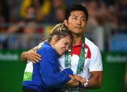 <p>Laura Gomez of Spain is comforted in defeat during the Women’s -52kg Elimination round of 16 against Andreea Chitu of Romania on Day 2 of the Rio 2016 Olympic Games at Carioca Arena 2 on August 7, 2016 in Rio de Janeiro, Brazil. (Photo by Laurence Griffiths/Getty Images) </p>