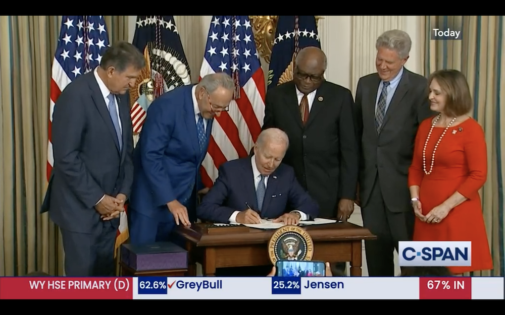 President Biden signed the Inflation Reduction Act into law on Tuesday, flanked from left to right by Sen. Joe Manchin (D-WV); Senate Majority Leader Chuck Schumer (D-NY); and Reps. Jim Clyburn(D-SC), Frank Pallone (D-NJ) and Kathy Castor (D-FL). (Photo: Screenshot from CSPAN)