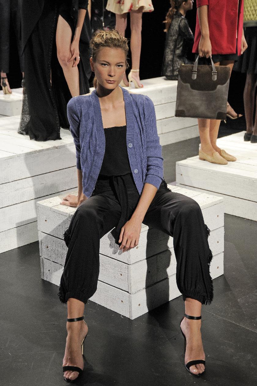 In this photo provided by Holmes & Yang, the Holmes & Yang Spring 2013 collection is modeled during Fashion Week in New York, Tuesday, Sept. 11, 2012. (AP Photo/Holmes & Yang, Dan Ashby)