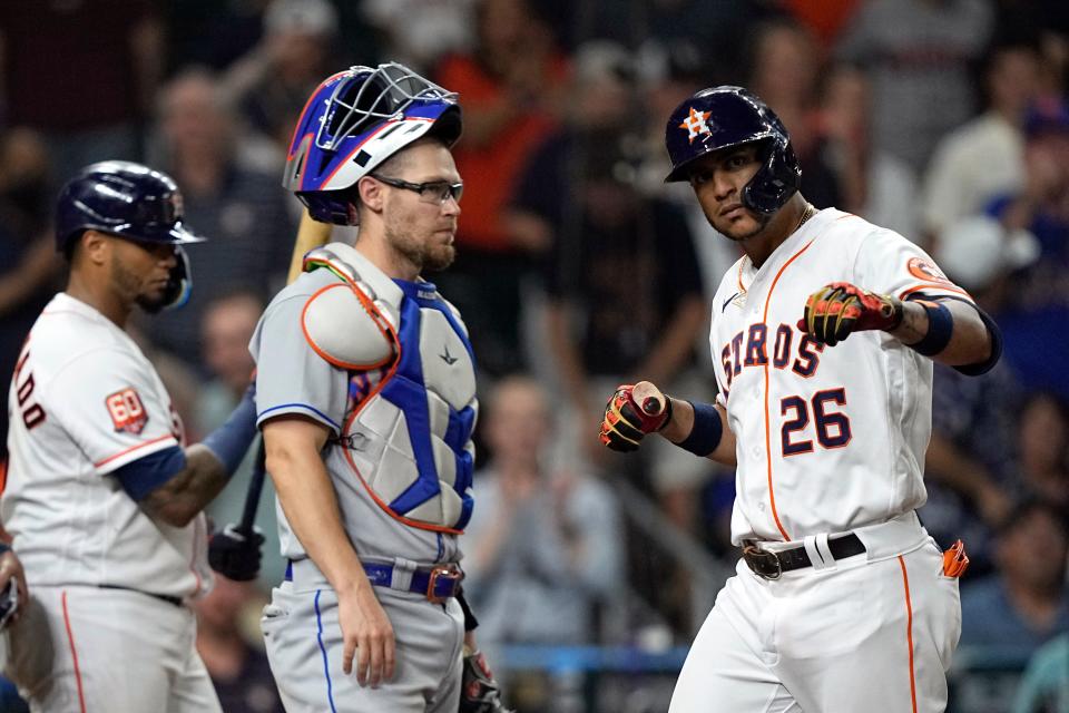 Houston Astros' Jose Siri (26) celebrates after hitting a home run as New York Mets catcher Patrick Mazeika watches during the eighth inning of a baseball game Tuesday, June 21, 2022, in Houston.