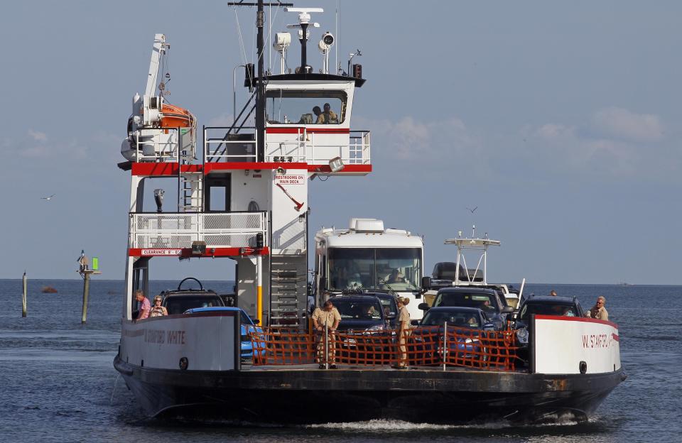 FILE - This Aug. 24, 2011 file photo shows a ferry from Ocracoke Island arriving in Hatteras, N.C. At the end of Hatteras Island, near the museum, you can take a free ferry from Hatteras Island to Ocracoke Island, which is still part of the national seashore. The ferry takes about 40 minutes. (AP Photo/Gerry Broome, File)