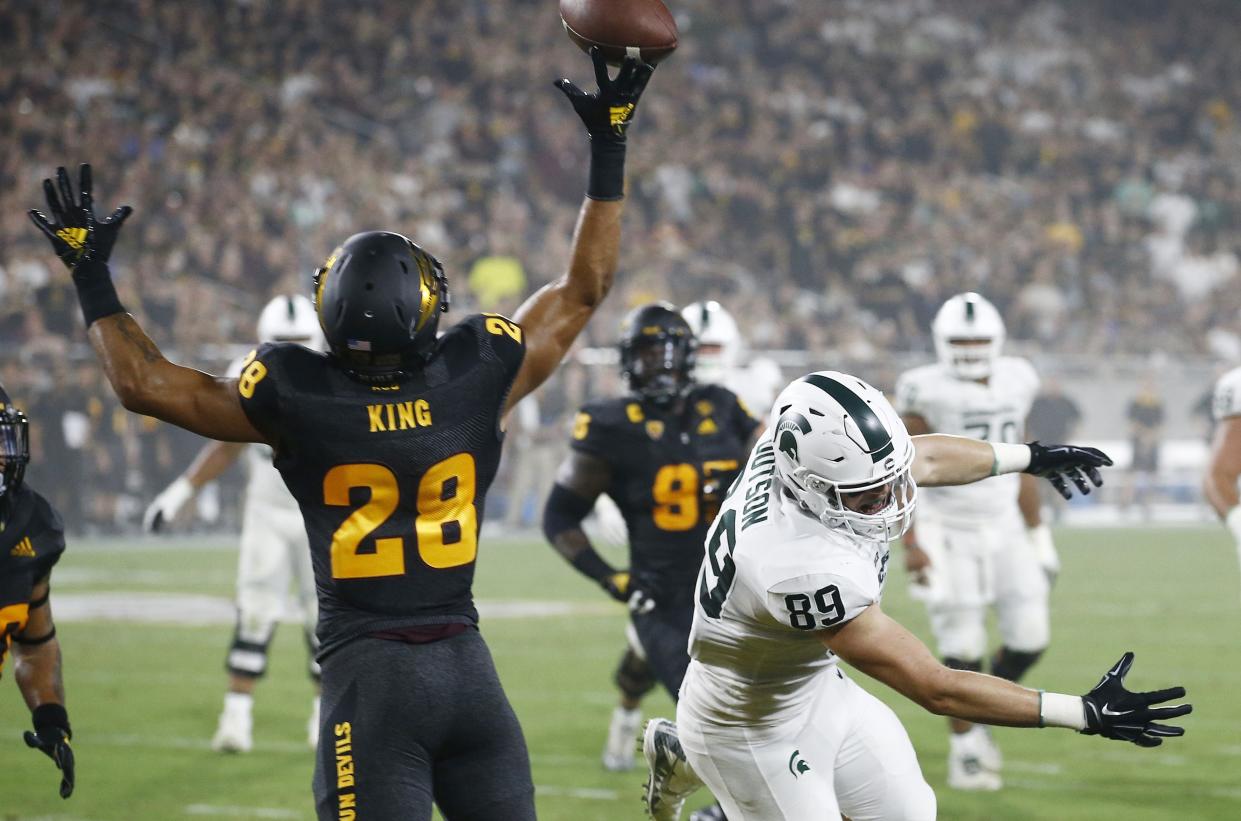 Arizona State defensive back Demonte King (L) tips a pass intended for Michigan State tight end Matt Dotson (R) during the first half of an NCAA college football game Saturday, Sept. 8, 2018, in Tempe, Ariz. (AP Photo/Ross D. Franklin)