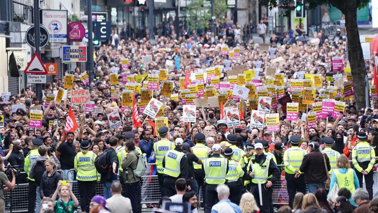 Thousands of counterprotesters rally after riots