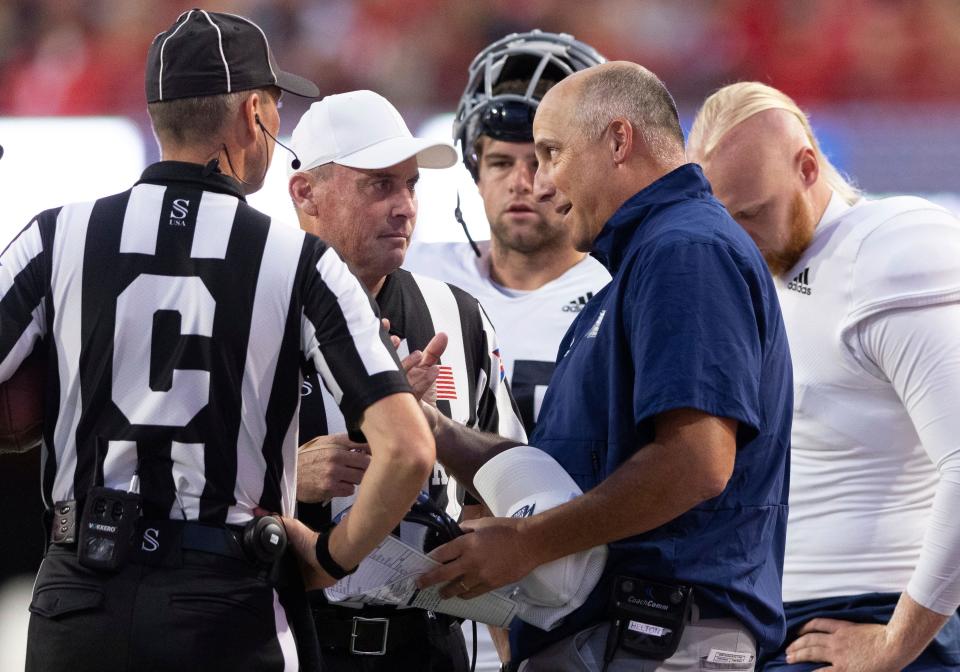 Georgia Southern head coach Clay Helton, front right, argues with referees following a touchdown against Nebraska during the first half on Saturday, Sept. 10, 2022, in Lincoln, Neb.