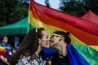 <p>A couple kisses during the 11th Gay Pride Parade in downtown Sofia on June 9, 2018, as gays, lesbians and transsexuals march through Bulgarian capital to protest against discrimination against homosexuals and improve their integration in the society. (Photo: Dimitar Dilkoff/AFP/Getty Images) </p>