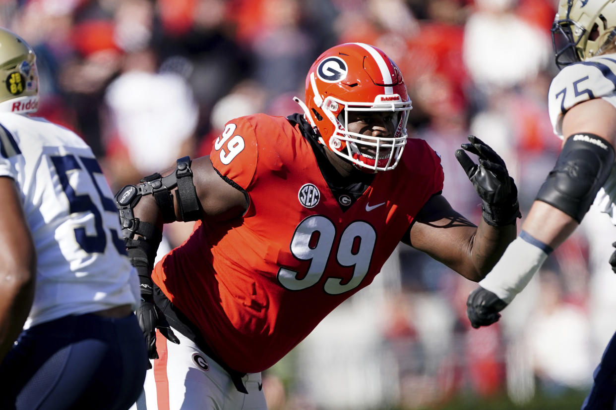 FILE - Georgia defensive lineman Jordan Davis (99) is shown in action against Charleston Southern in the first half of an NCAA college football game Saturday, Nov. 20, 2021, in Athens, Ga. Davis was selected to The Associated Press All-SEC team in results released Wednesday, Dec. 8, 2021. (AP Photo/John Bazemore, File)