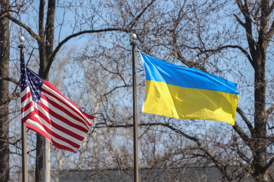 A Ukrainian flag flies next to the American flag during Mass Sunday, Feb 27, 2022; at St. Nicholas Ukrainian Catholic Church in Wilmington, Delaware, United States.