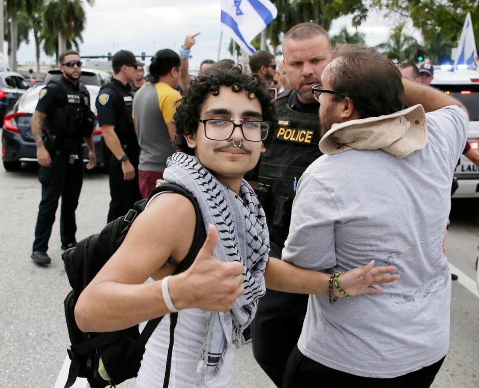 Damian Rodriguez, one of just a few Palestinian supporters that showed up, shows thumb up on October 8, 2023 in Fort Lauderdale.