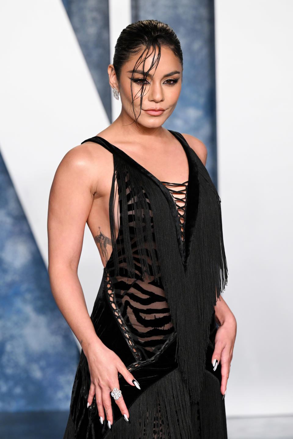 Vanessa Hudgens wears a fringe gown at the Vanity Fair Oscar Party on March 12, 2023