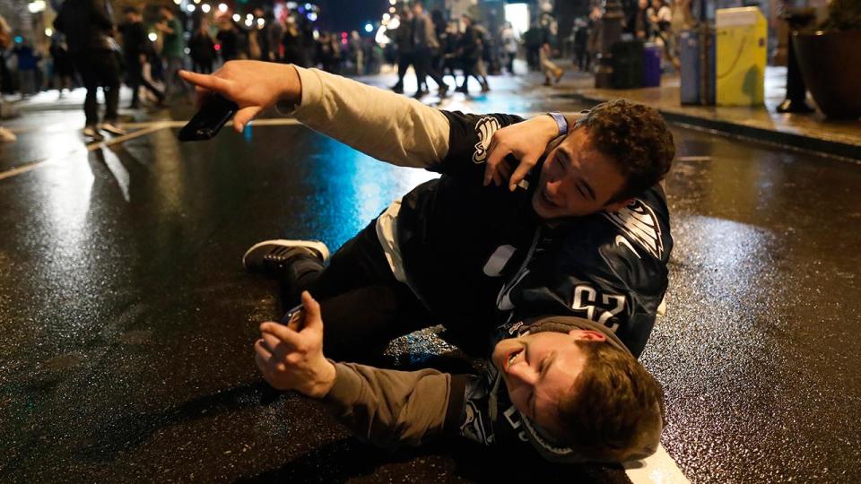 <p>Wrestling in the street.</p>