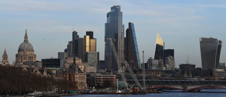 The skyline of the City of London is seen in the evening sunlight on December 17, 2020. - Stock markets mostly gained Thursday as investors kept an eye on US stimulus progress and the rollout of vaccines but surging infections and new lockdowns tempered gains. The pound held around 19-month highs against the dollar as the Bank of England held fire over interest rates and stimulus as Britain and the EU continue their 11th-hour talks on their post-Brexit trading arrangement. (Photo by DANIEL LEAL-OLIVAS / AFP) (Photo by DANIEL LEAL-OLIVAS/AFP via Getty Images)