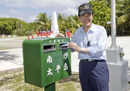 Taiwan's President Ma Ying-jeou mails a letter on the disputed Itu Aba or Taiping island in the South China Sea, January 28, 2016. REUTERS/Chen Chien Hsing/Presidential Office/Handout