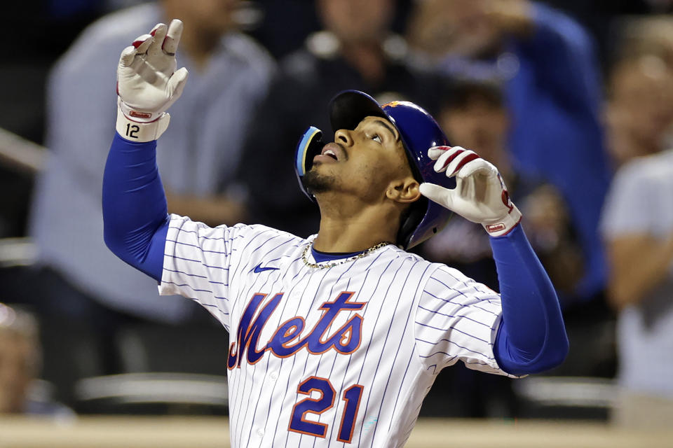 New York Mets' Francisco Lindor reacts after hitting a two-run home run against the Pittsburgh Pirates during the third inning of a baseball game Thursday, Sept. 15, 2022, in New York. (AP Photo/Adam Hunger)