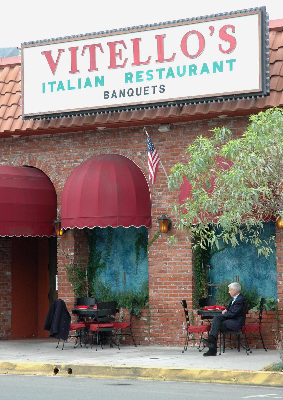 Actor Robert Blake sits at a table in front of Vitello’s Restaurant on Oct. 25, 2005. - Credit: AP Photo/Mike Meadows