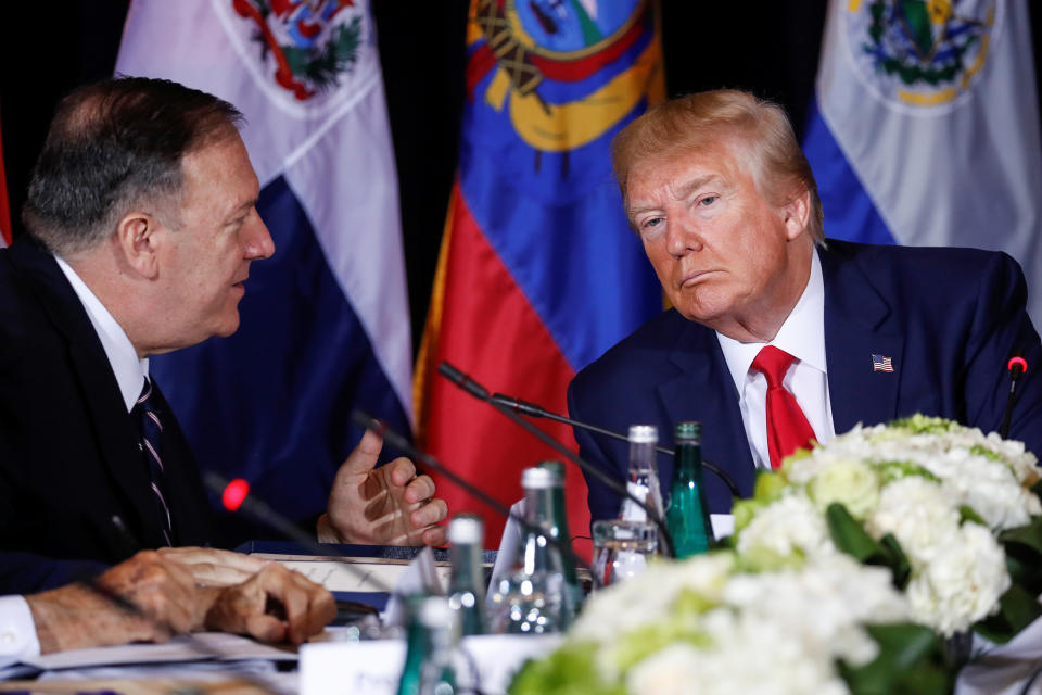 U.S. President Donald Trump confers with U.S. Secretary of State Mike Pompeo during a multilateral meeting with Western Hemisphere leaders about Venezuela during the 74th session of the United Nations General Assembly (UNGA) at U.N. headquarters in New York City, New York, U.S., September 25, 2019.  REUTERS/Jonathan Ernst