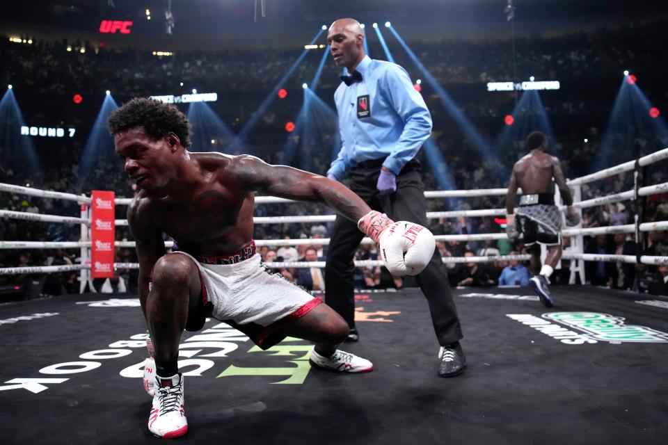 Errol Spence Jr tries to get up after a knockdown (AP)