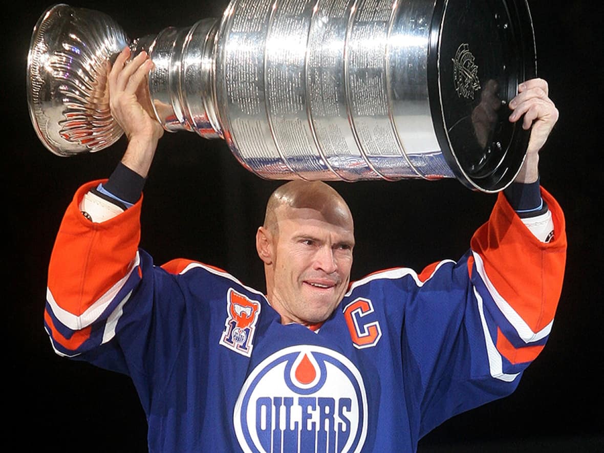 Messier, seen here in an Edmonton Oilers uniform hoisting the Stanley Cup, played on six Stanley Cup championship teams. (Tim Smith/Getty Images - image credit)