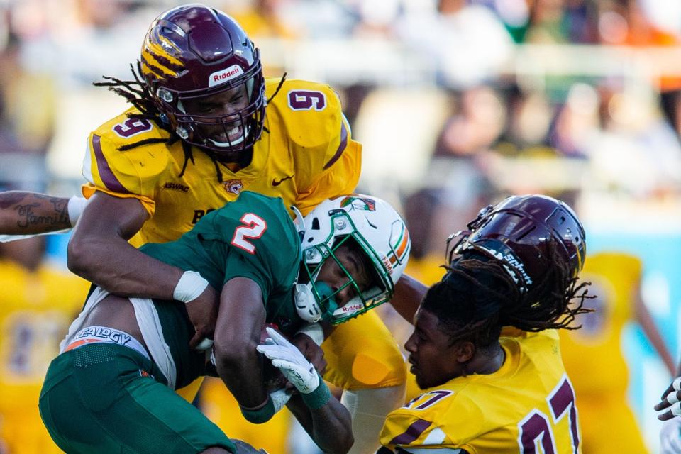Bethune-Cookman's Eddie Walls III (9) hits Florida A&M's Jamari Gassett (2) during the Rattlers' 24-7 win in the Florida Classic at Camping World Stadium on Saturday, Nov. 18, 2023.
