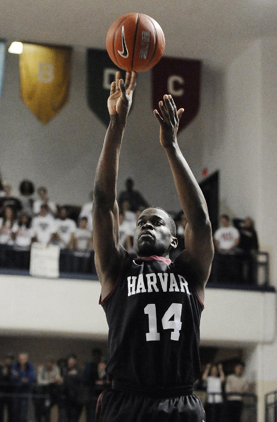 Harvard's Steve Moundou-Missi shoots during the first half of an NCAA college basketball game against Yale, Friday, March 7, 2014, in New Haven, Conn. (AP Photo/Jessica Hill)