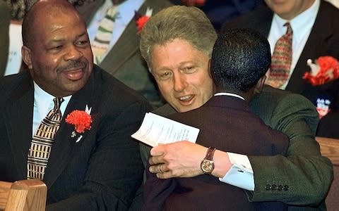 Rep. Elijah Cummings during a church service with Bill Clinton - Credit: AP