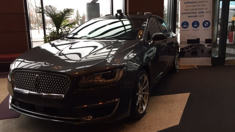 Businesspeople celebrate Ford's future driverless car centre in Kanata