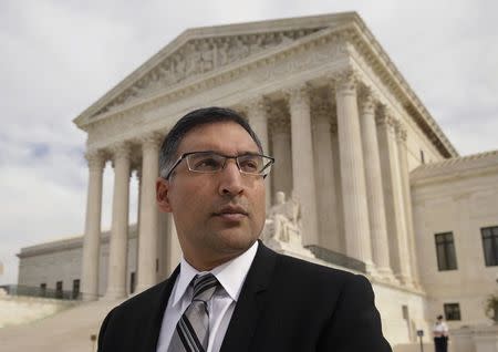 Attorney Neal Katyal, who runs the Supreme Court practice at the Hogan Lovells law firm, is seen in front of the Supreme Court building after arguing a case before the court in Washington November 4, 2014. REUTERS/Gary Cameron