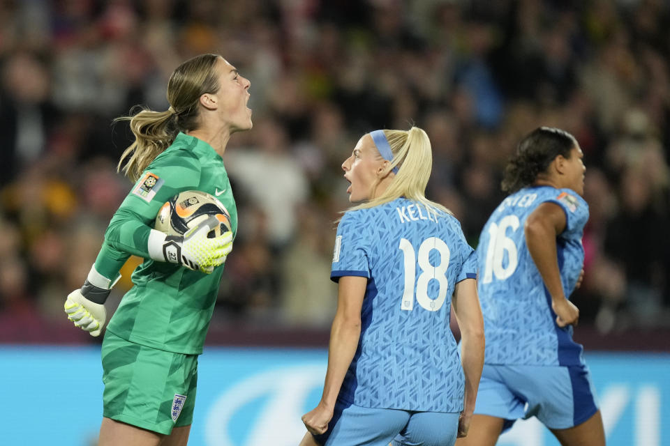 England's goalkeeper Mary Earps, left, reacts after saving a penalty shot by Spain's Jennifer Hermoso during the final of Women's World Cup soccer between Spain and England at Stadium Australia in Sydney, Australia, Sunday, Aug. 20, 2023. (AP Photo/Rick Rycroft)