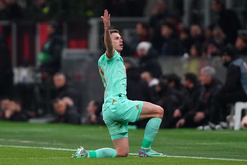 Slavia Prague's David Doudera celebrates scoring his side's first goal during the UEFA Europa League round of 16 first leg soccer match between Ac Milan and SK Slavia Prague at San Siro Stadium. -/LaPresse via ZUMA Press/dpa