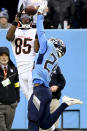 Cincinnati Bengals wide receiver Tee Higgins (85) pulls in a pass against Tennessee Titans cornerback Kristian Fulton (26) during the second half of an NFL football game, Sunday, Nov. 27, 2022, in Nashville, Tenn. The Cincinnati Bengals won 20-16. (AP Photo/Mark Zaleski)